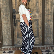 Navy and white polka dot wide leg pants