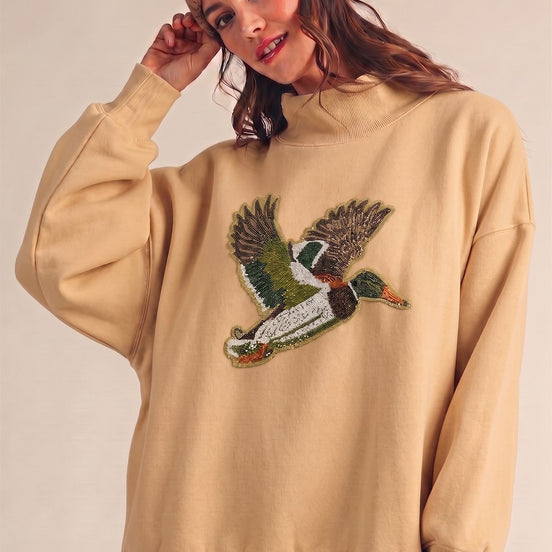 LUXE SEQUIN EMBROIDERED OVERSIZED MOCK NECK TOP